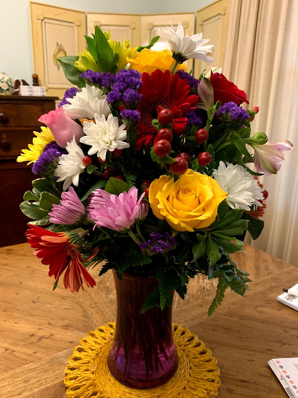Bouquet of Flowers in a purple vase. Roses, Daisies &  chrysanthemums. 