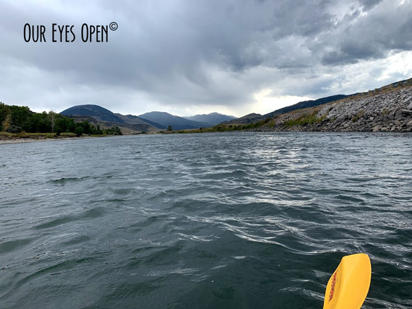 A moment to survey the approaching storm while paddling the Yellowstone River.