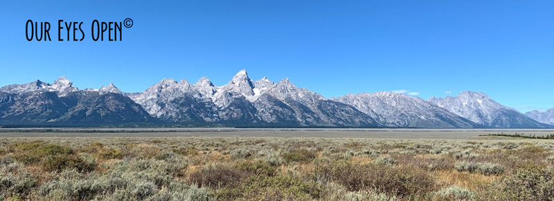 Standing in Teton Valley with a gorgeous view of Grand Teton Mountain Range.
