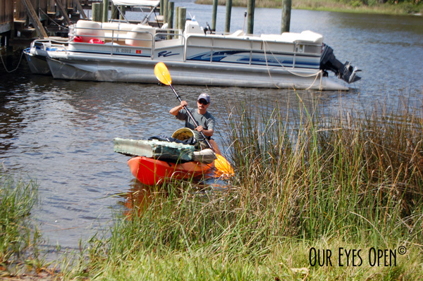 Frank coming in with all the garbage that he picked up and placed in the kayak out of the St. Johns River.