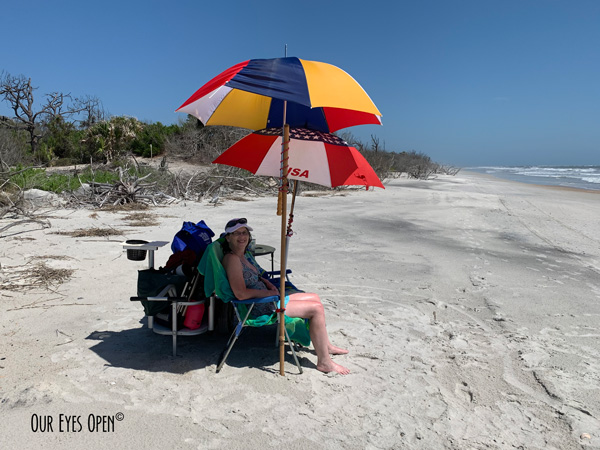 Me, Lisa Coleman sitting under the umbrellas on the beach at Little Talbot Island State Park on Memorial Day Weekend, 2020.