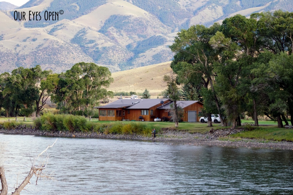 Home sitting on the Yellowstone River with mountains in the backdrop.
