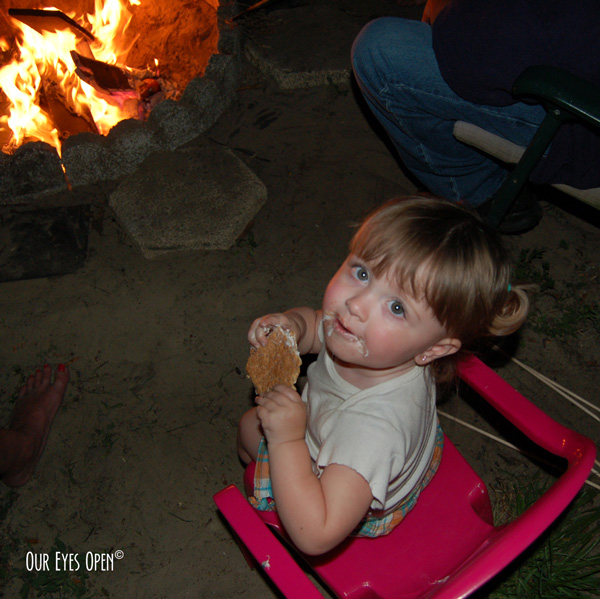 Sitting around the campfire enjoying some smores with the granddaughter.