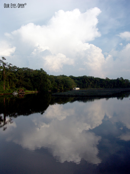Clouds reflecting off the water of Little Pottsburg Creek in Jacksonville, Florida.