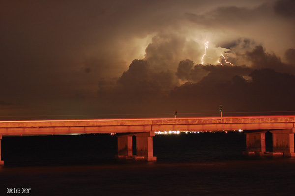 Lighting within an approaching storm in St. Petersburg, Florida from the foot of the Sunshine Skyway Bridge.