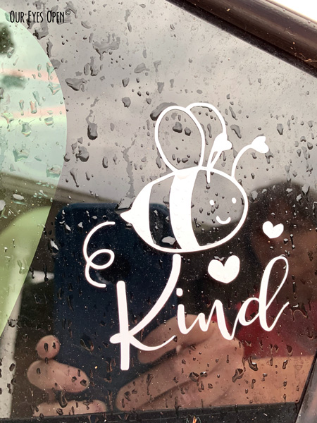 Photo of my hand made Be Kind (Bee Kind) vinyl decal perfect for putting on a glass window. Shop Today! https://etsy.me/38Dufa7