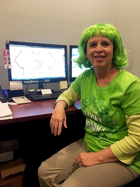 I was wearing my "Lucky Grandma" t-shirt and green wig on St. Patrick's Day, 2018. I was designing a t-shirt for a client on my computer. If you would like to see what costume that green wig goes to, check out my blog here. It's worth a peak. Yes, that is me when you see it!