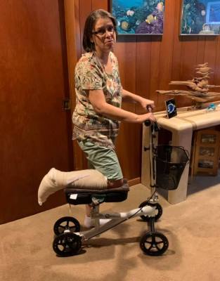 Me on my knee scooter just after foot surgery.