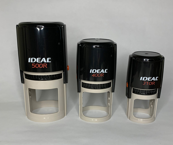 Three size round self-inking stamps taking for product shots for a listing on my Etsy shop.  https://www.etsy.com/listing/1016468144/logo-stamp-custom-logo-stamp-your-logo?ref=shop_home_active_1